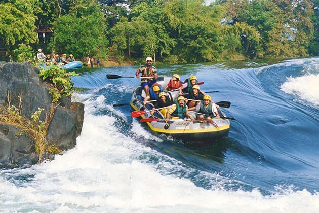 Boat riding adventure in Sri Lanka through scenic rivers and lush tropical landscapes